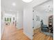 Elegant hallway with gleaming wood floors and open access to dining and living areas at 2585 Hickory Rd, Canton, GA 30115