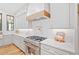 Modern kitchen with stainless steel appliances, wood accents, and white subway tile backsplash at 2585 Hickory Rd, Canton, GA 30115