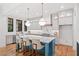 Bright, updated kitchen with hardwood floors, island with seating, modern appliances, and ample cabinet space at 2585 Hickory Rd, Canton, GA 30115