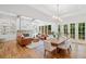 Open-concept floor plan featuring hardwood floors, gourmet kitchen, dining room, living room with fireplace and exposed beams at 2585 Hickory Rd, Canton, GA 30115