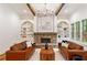 Inviting living room features a stone fireplace, custom built-ins, and comfortable seating at 2585 Hickory Rd, Canton, GA 30115