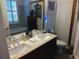 Vanity with double sinks, with large mirror, and a tiled tub are some of the features in this bathroom at 3655 Peachtree Rd # 203, Atlanta, GA 30319