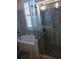Bathroom with tiled walls, a glass enclosed shower, and a soaking tub with jacuzzi jets at 3655 Peachtree Rd # 203, Atlanta, GA 30319