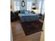 Bedroom with plantation shutters, wood floors, and a comfy upholstered bed at 3655 Peachtree Rd # 203, Atlanta, GA 30319