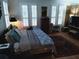 Relaxing bedroom featuring beautiful windows with shutter, hardwood floors, and elegant decor at 3655 Peachtree Rd # 203, Atlanta, GA 30319