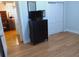 Bedroom featuring a dark dresser and a closet with doors in front of a hardwood floor at 3655 Peachtree Rd # 203, Atlanta, GA 30319