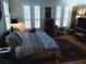 Tranquil bedroom featuring hardwood floors, shuttered windows, and cozy decor at 3655 Peachtree Rd # 203, Atlanta, GA 30319