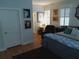 Serene bedroom with hardwood floors, plush seating, and natural light at 3655 Peachtree Rd # 203, Atlanta, GA 30319