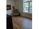 Cozy bedroom featuring hardwood floors, natural light, and a serene ambiance at 3655 Peachtree Rd # 203, Atlanta, GA 30319