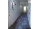 Bright hallway with modern lighting and gray patterned flooring at 3655 Peachtree Rd # 203, Atlanta, GA 30319