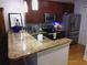 Modern kitchen features granite countertops, stainless steel appliances, and cherry cabinets at 3655 Peachtree Rd # 203, Atlanta, GA 30319