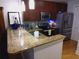Modern kitchen with stainless steel appliances, granite countertops, and ample cabinet space at 3655 Peachtree Rd # 203, Atlanta, GA 30319