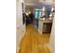 Inviting living space featuring hardwood floors and a seamless open floor plan to the kitchen and beyond at 3655 Peachtree Rd # 203, Atlanta, GA 30319