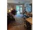 Cozy living room with hardwood floors, plush seating, and access to a balcony at 3655 Peachtree Rd # 203, Atlanta, GA 30319