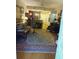 Charming living area with a large rug, stylish furniture, and a view to the kitchen at 3655 Peachtree Rd # 203, Atlanta, GA 30319