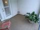 Charming outdoor patio with white-framed doors, tiled floor, and cozy seating area at 3655 Peachtree Rd # 203, Atlanta, GA 30319