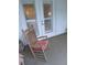 Relaxing porch setting with a wooden rocking chair and tiled flooring at 3655 Peachtree Rd # 203, Atlanta, GA 30319