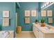 A full bath with a double sink vanity, a walk-in shower and large tub at 4150 Soaring Dr, Douglasville, GA 30135