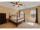 Tranquil bedroom features natural light and a four poster bed at 4150 Soaring Dr, Douglasville, GA 30135