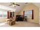 A large bedroom with a sitting area, workspace, and lots of natural light at 4150 Soaring Dr, Douglasville, GA 30135