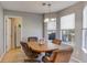 Inviting dining area with a wood table, chandelier, and natural light from multiple windows at 4150 Soaring Dr, Douglasville, GA 30135