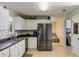 Well-lit kitchen with stainless steel appliances and plenty of cabinet space at 4150 Soaring Dr, Douglasville, GA 30135