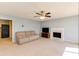 Spacious living room featuring a fireplace, neutral colors, and cozy furniture arrangement at 4150 Soaring Dr, Douglasville, GA 30135