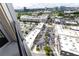 High-angle shot showing rooftops and parking lots, plus the lush greenery and city skyline at 4561 Olde Perimeter Way # 2102, Atlanta, GA 30346