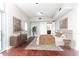 Bedroom with hardwood floors and neutral walls, enhanced by natural light and a contemporary dresser at 4561 Olde Perimeter Way # 2102, Atlanta, GA 30346