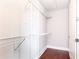 Walk-in closet with metal shelving and a door, offering ample storage space at 4561 Olde Perimeter Way # 2102, Atlanta, GA 30346