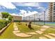 Charming dog run with artificial turf, stepping stones, and flowerpots, providing a delightful space for pets at 4561 Olde Perimeter Way # 2102, Atlanta, GA 30346