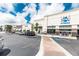 Exterior view of Crunch Fitness and other businesses in a shopping center at 4561 Olde Perimeter Way # 2102, Atlanta, GA 30346