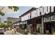 A vibrant scene with outdoor dining at Culinary Dropout and shops nearby at 4561 Olde Perimeter Way # 2102, Atlanta, GA 30346