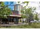 Charming storefront with outdoor seating and modern architectural design at 4561 Olde Perimeter Way # 2102, Atlanta, GA 30346