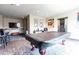Fun game room with a covered pool table, TV, and bar stools, perfect for entertainment at 4561 Olde Perimeter Way # 2102, Atlanta, GA 30346