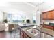 Cozy kitchen features stone counters, breakfast bar, and expansive views of the city skyline and living area at 4561 Olde Perimeter Way # 2102, Atlanta, GA 30346
