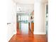 Open-concept kitchen with stone counters, wood cabinets, stainless appliances, island, and expansive windows with panoramic views at 4561 Olde Perimeter Way # 2102, Atlanta, GA 30346