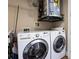 Bright laundry room with a modern washer and dryer set, complemented by practical shelving at 4561 Olde Perimeter Way # 2102, Atlanta, GA 30346