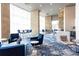 Inviting lounge area with elegant seating, contemporary lighting, and a view of the building's surroundings at 4561 Olde Perimeter Way # 2102, Atlanta, GA 30346