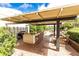 Outdoor kitchen with bar seating and barbecue area for entertainment at 4561 Olde Perimeter Way # 2102, Atlanta, GA 30346