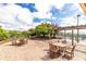 Relaxing patio area with multiple wooden tables and chairs, perfect for outdoor dining at 4561 Olde Perimeter Way # 2102, Atlanta, GA 30346