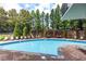 Refreshing outdoor pool with comfortable lounge chairs and a relaxing pergola area amidst lush greenery at 4561 Olde Perimeter Way # 2102, Atlanta, GA 30346