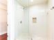 Enclosed tiled shower with a lattice shower floor design and a built in toiletry shelf at 4561 Olde Perimeter Way # 2102, Atlanta, GA 30346
