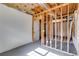 Unfinished basement space with stud framing, gray painted floor and white walls ready for customization at 130 Opal Ln, Carrollton, GA 30116
