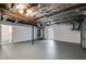 Expansive unfinished basement area with gray floor, white walls, and open ceiling with utilities at 130 Opal Ln, Carrollton, GA 30116