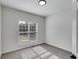 Bright bedroom featuring neutral carpet and natural light from the window, creating a warm ambiance at 130 Opal Ln, Carrollton, GA 30116