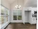 Bright kitchen and dining area showcasing white cabinetry, stainless appliances, and hardwood floors at 130 Opal Ln, Carrollton, GA 30116