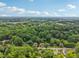 Panoramic aerial shot of the neighborhood showcasing mature trees and well-spaced homes at 1605 Wellswood Se Dr, Atlanta, GA 30315