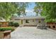 Charming backyard features an outdoor kitchen, stone fire pit, patio, and a privacy fence at 1605 Wellswood Se Dr, Atlanta, GA 30315