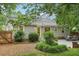 Well maintained backyard featuring a yellow back door and stone outdoor kitchen at 1605 Wellswood Se Dr, Atlanta, GA 30315